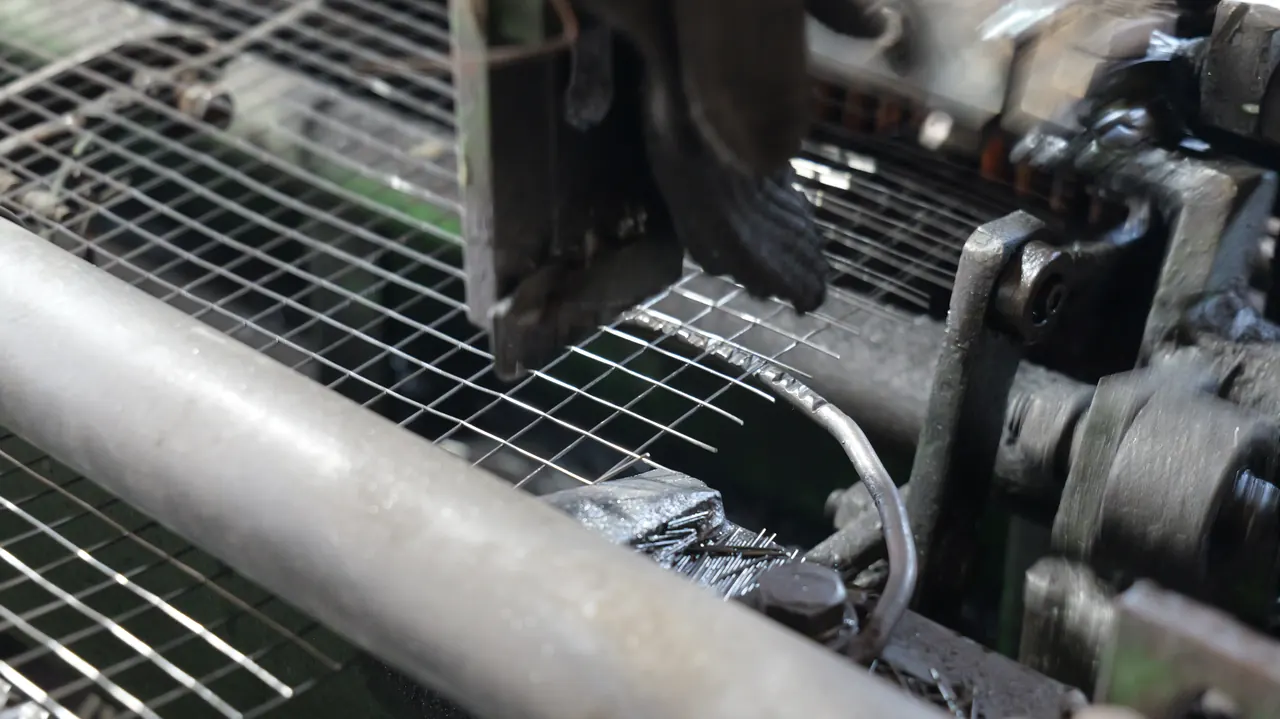 Close view of welded wire mesh intersections forming on ANJIA production equipment