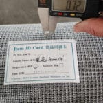 Factory quality control measuring 0.72mm wire diameter of 4mm aperture galvanized crimped wire mesh with digital vernier caliper and product item ID card | ANJIA