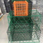 Green & orange PVC coated hexagonal gabion basket samples stacked factory display for custom color demand | ANJIA