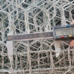 Stacked galvanized welded wire mesh gabion boxes packed for delivery | ANJIA