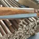 Bulk aluminum window screen packaging and storage in warehouse with wooden frames for bulk order shipment | ANJIA GROUP