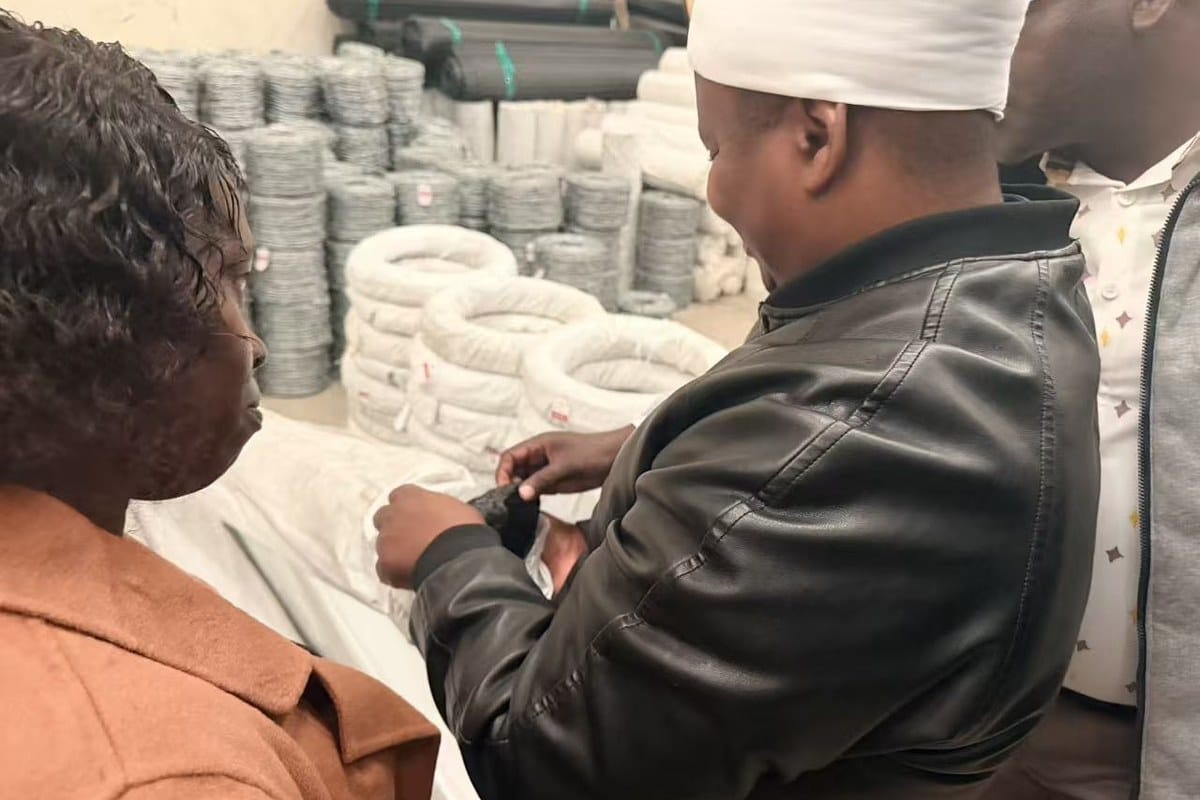 ANJIA KENYA customers reviewing wire mesh product formats in the Nairobi warehouse