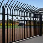 Close-up view of decorative curved spear top black steel palisade fence for residential garden and villa perimeter security | ANJIA