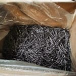 Bulk galvanized iron nails stored in cartons inside factory warehouse | ANJIA