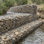 Stone filled galvanized hexagonal gabion baskets installed for river bank erosion control water conservancy project | ANJIA
