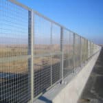 Hot dipped galvanized steel frame welded wire mesh fence installed along elevated highway for traffic perimeter safety protection | ANJIA