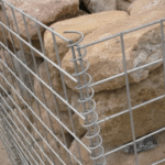 Close-up detail of helical coil connector for galvanized welded gabion box stone retaining structure | ANJIA