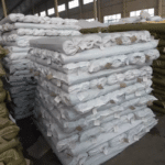 Stacked packaged rolls of plastic insect window screen prepared for wholesale export | ANJIA