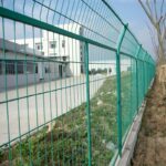 Green powder coated welded wire mesh frame fence installed around factory plant area for industrial perimeter security protection | ANJIA