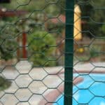 PVC coated hexagonal wire mesh installed as garden perimeter fence | ANJIA