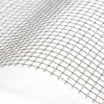 Close-up detail of stainless steel square crimped woven wire mesh surface texture on pure white background | ANJIA