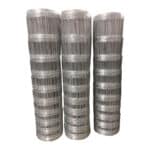 Three stacked rolls of hot dipped galvanized fixed knot cattle farm fence for bulk wholesale export | ANJIA