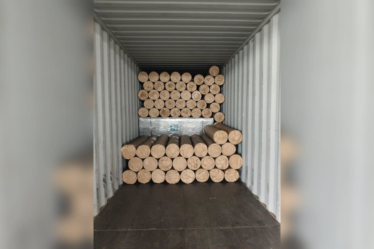 Wire mesh rolls arranged inside a container for loading readiness check