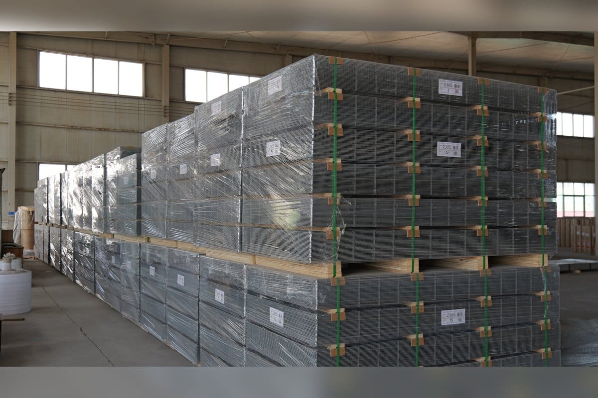 Wrapped wire mesh panels stacked in warehouse before pre-shipment inspection