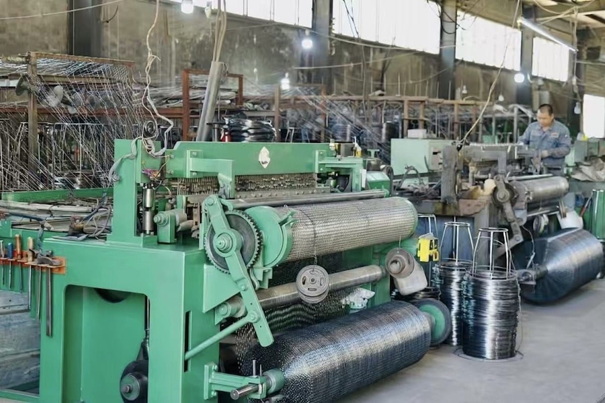 Wire mesh production workshop audit photo with mesh machinery and material in process