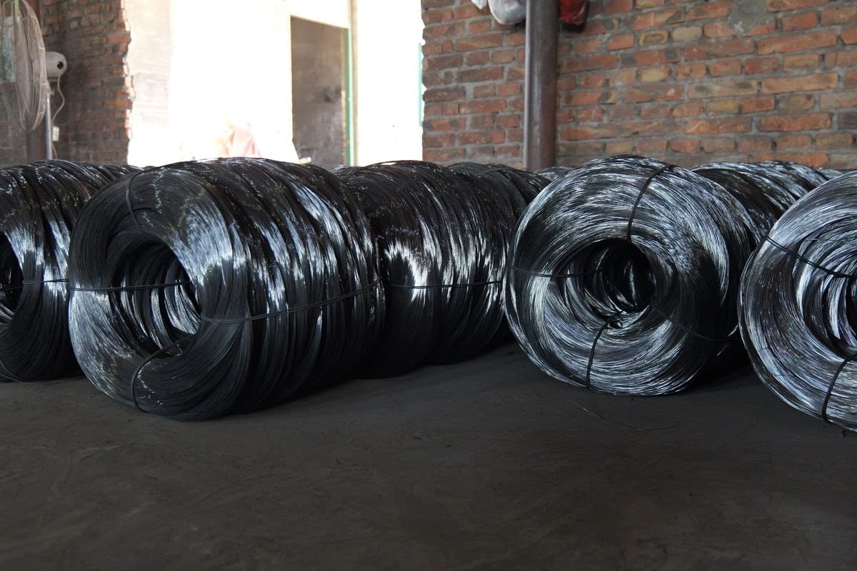 Wire mesh raw material storage audit photo with wire coils before production