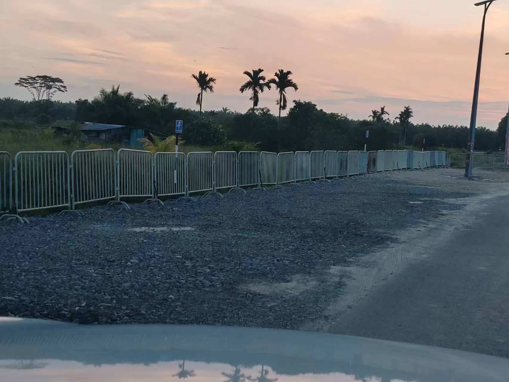 Temporary pedestrian barriers arranged for site circulation at a Kenyalang Smart City project area in Miri