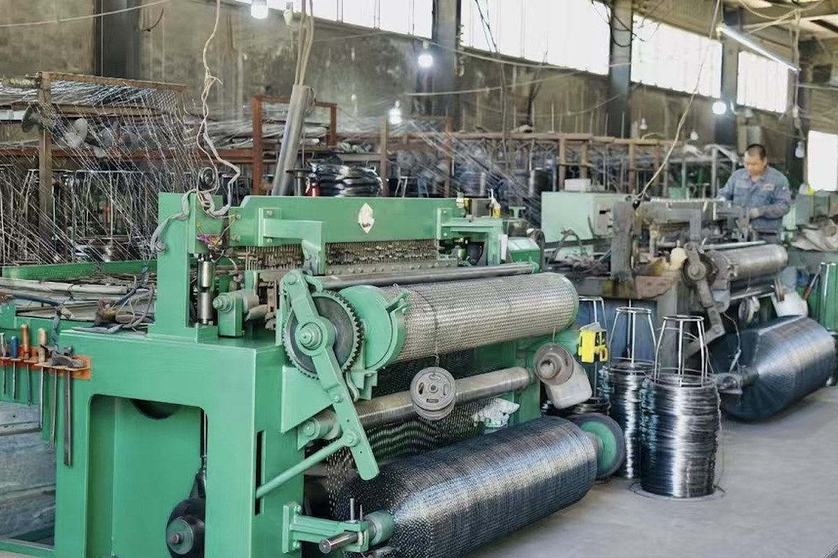 Automated wire mesh production workshop inside ANJIA GROUP factory with wire coils and mesh machine